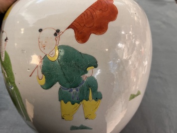 A Chinese famille rose 'Qi Lin Song Zi 麒麟送子' jar and wooden cover, Qianlong/Jiaqing