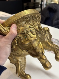 A large Chinese precious stone-inlaid gilt bronze 'elephant' tripod censer and cover on wooden stand, 19th C.