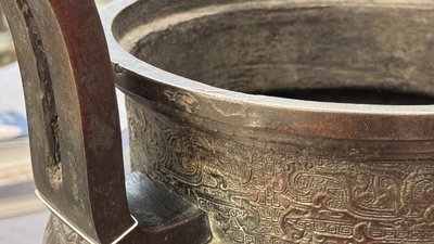 A large Chinese bronze archaistic 'taotie' tripod censer, 18th C.