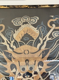 A Chinese embroidered silk tapestry with a five-clawed dragon among clouds and bajixiang, 18/19th C.