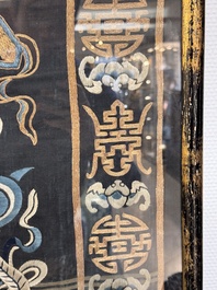 A Chinese embroidered silk tapestry with a five-clawed dragon among clouds and bajixiang, 18/19th C.