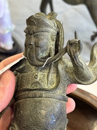 A Vietnamese bronze brush washer on stand and a Chinese bronze warrior on horseback, 19th C.