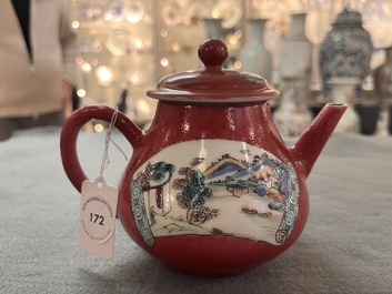 A Chinese famille rose ruby-ground 'landscape scroll' teapot, Yongzheng