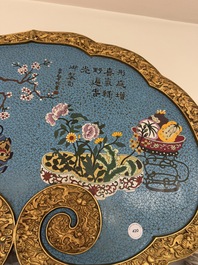 A large Chinese cloisonn&eacute; ruyi-shaped plaque with antiquities, 19/20th C.