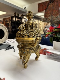 A large Chinese precious stone-inlaid gilt bronze 'elephant' tripod censer and cover on wooden stand, 19th C.
