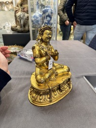 A Sino-Tibetan gilt bronze Virūpa, 19th C.