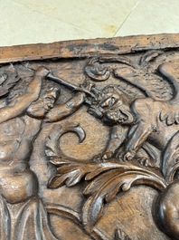 A carved walnut panel depicting the victory of good over evil, 16th C.