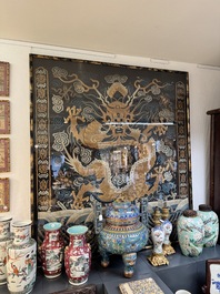 A Chinese embroidered silk tapestry with a five-clawed dragon among clouds and bajixiang, 18/19th C.