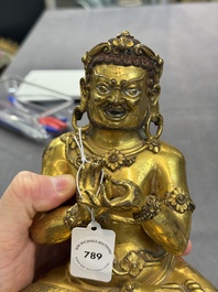 A Sino-Tibetan gilt bronze Virūpa, 19th C.