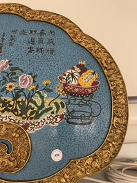 A large Chinese cloisonn&eacute; ruyi-shaped plaque with antiquities, 19/20th C.