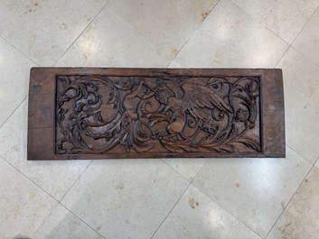 A carved walnut panel depicting the victory of good over evil, 16th C.