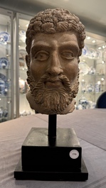 A large terracotta head of a bearded man, Gandhara region, Kushan period, 4/5th C.