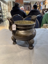 A Chinese bronze tripod censer with two handles, Ming