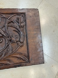 A carved walnut panel depicting the victory of good over evil, 16th C.