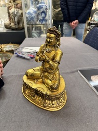 A Sino-Tibetan gilt bronze Virūpa, 19th C.