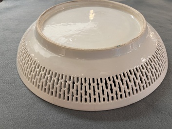A Chinese famille rose 'mandarin subject' dish with a reticulated border, Qianlong