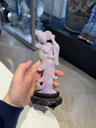 A Chinese lavender- and mint-green-jade figure of a goddess holding a sceptre and fan on wooden stand, 19th C.