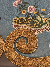 A large Chinese cloisonn&eacute; ruyi-shaped plaque with antiquities, 19/20th C.