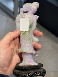 A Chinese lavender- and mint-green-jade figure of a goddess holding a sceptre and fan on wooden stand, 19th C.