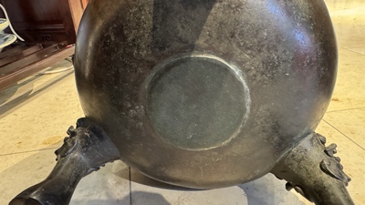 A large Chinese bronze archaistic 'taotie' tripod censer, 18th C.
