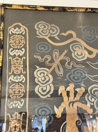 A Chinese embroidered silk tapestry with a five-clawed dragon among clouds and bajixiang, 18/19th C.