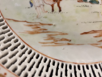 A Chinese famille rose 'mandarin subject' dish with a reticulated border, Qianlong