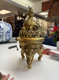 A large Chinese precious stone-inlaid gilt bronze 'elephant' tripod censer and cover on wooden stand, 19th C.