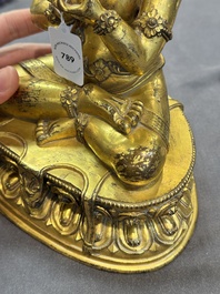 A Sino-Tibetan gilt bronze Virūpa, 19th C.