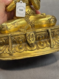 A Sino-Tibetan gilt bronze Virūpa, 19th C.