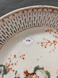 A Chinese famille rose 'mandarin subject' dish with a reticulated border, Qianlong