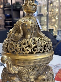 A large Chinese precious stone-inlaid gilt bronze 'elephant' tripod censer and cover on wooden stand, 19th C.