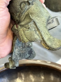 A Vietnamese bronze brush washer on stand and a Chinese bronze warrior on horseback, 19th C.