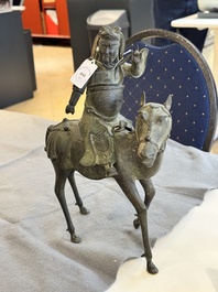 A Vietnamese bronze brush washer on stand and a Chinese bronze warrior on horseback, 19th C.