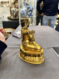 A Sino-Tibetan gilt bronze Virūpa, 19th C.