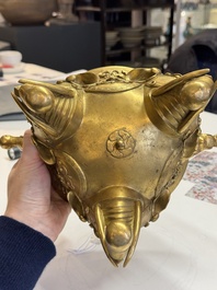 A large Chinese precious stone-inlaid gilt bronze 'elephant' tripod censer and cover on wooden stand, 19th C.