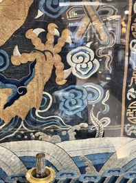 A Chinese embroidered silk tapestry with a five-clawed dragon among clouds and bajixiang, 18/19th C.