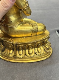 A Sino-Tibetan gilt bronze Virūpa, 19th C.