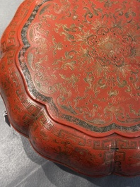 A Chinese red lacquer box and cover with floral design, 19/20th C.