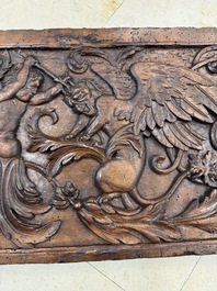 A carved walnut panel depicting the victory of good over evil, 16th C.