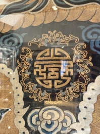 A Chinese embroidered silk tapestry with a five-clawed dragon among clouds and bajixiang, 18/19th C.