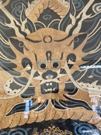 A Chinese embroidered silk tapestry with a five-clawed dragon among clouds and bajixiang, 18/19th C.