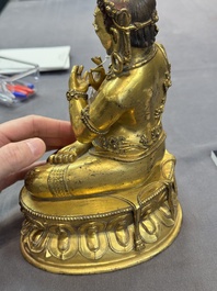 A Sino-Tibetan gilt bronze Virūpa, 19th C.