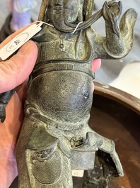 A Vietnamese bronze brush washer on stand and a Chinese bronze warrior on horseback, 19th C.