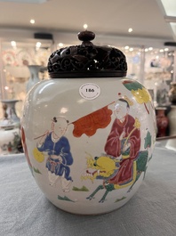 A Chinese famille rose 'Qi Lin Song Zi 麒麟送子' jar and wooden cover, Qianlong/Jiaqing