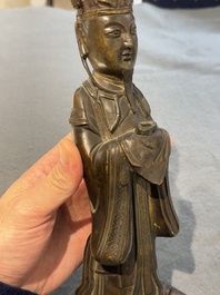 A Chinese bronze figure of an official, Ming