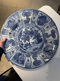 A large Chinese blue and white 'kraak' dish with birds among flowering branches, Wanli