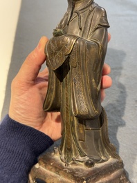 A Chinese bronze figure of an official, Ming