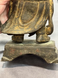 A pair of fine Chinese gilt bronze heavenly kings on stand, Ming