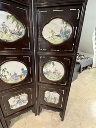 A Chinese four-fold wooden room divider with famille rose 'Romance of the Western Chamber' plaques, Republic