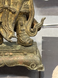 A pair of fine Chinese gilt bronze heavenly kings on stand, Ming